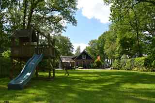 Woody 6 to 12 person holiday home with goats and play meadow in Koekan...