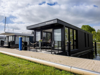 Durable 4 person houseboat with air conditioning on the Sneekermeer in...