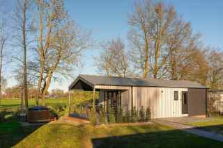 Luxury 2-people lodge with private sauna and hottub on a holiday park...