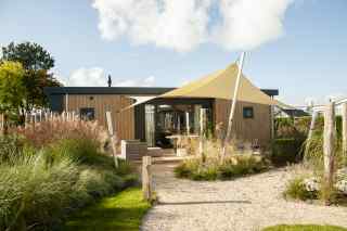 Luxuriöse Duin-Lodge für 4 Personen in der Nähe des Strandes von Nieuw...