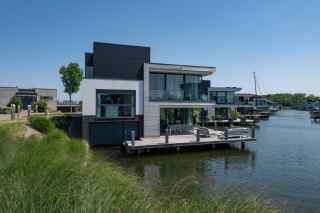 A stylish 8-person villa with a private jetty on the Veerse Meer in Ar...