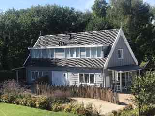 Stylish semi-detached 6-person holiday home with spacious garden in Ou...