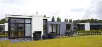 Luxurious 4-person accommodation with sliding doors on holiday park