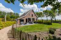 Luxury 7 person holiday home in Vrouwenpolder on a beautiful location.
