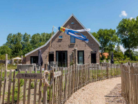 Luxury 8 person holiday home in Vrouwenpolder on a beautiful location.